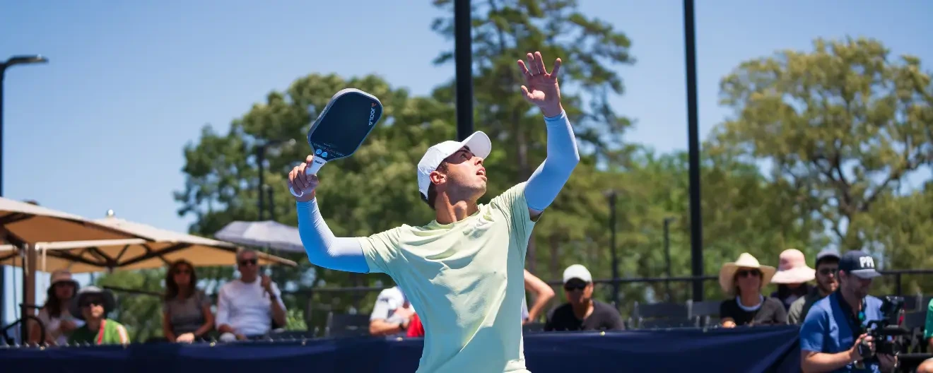 Ben Johns hits a pickleball overhead.