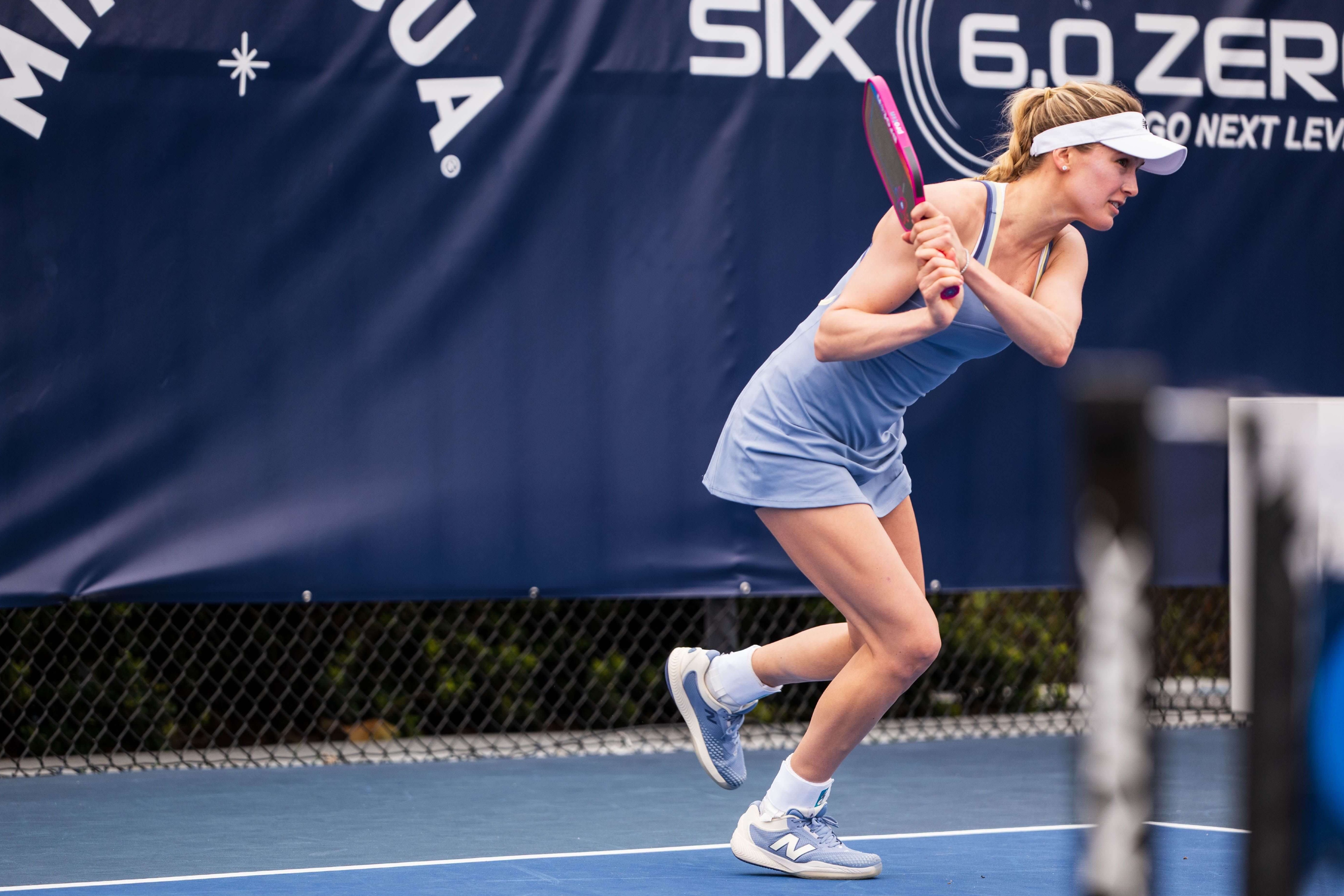 Genie Bouchard in a lilac tennis dress and matching shoes