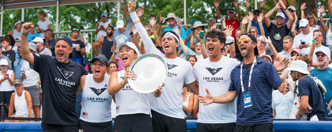 The Las Vegas Night Owls celebrate with their trophy.