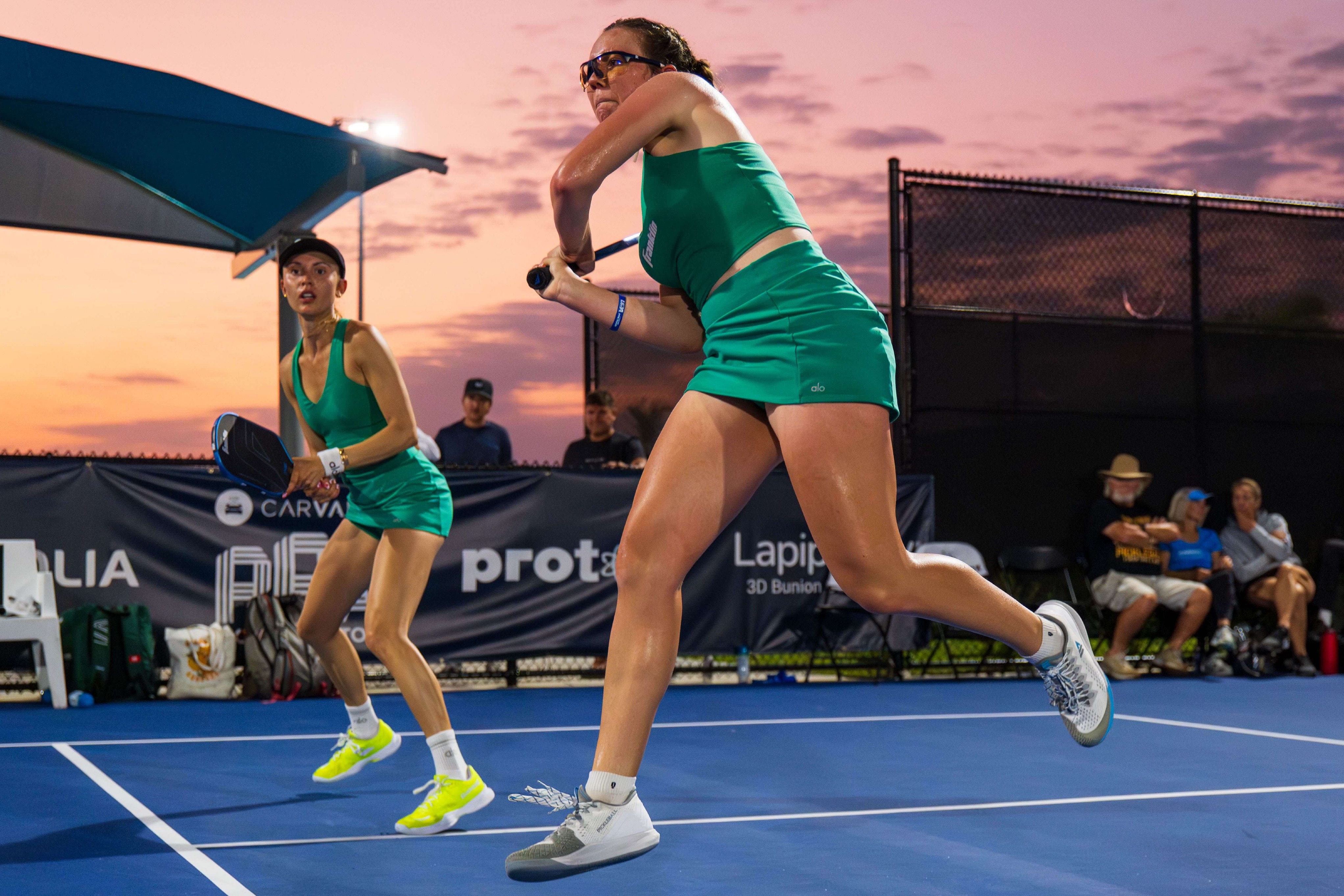 Jorja Johnson and Parris Todd in matching green sets at the Veolia Cape Coral Open