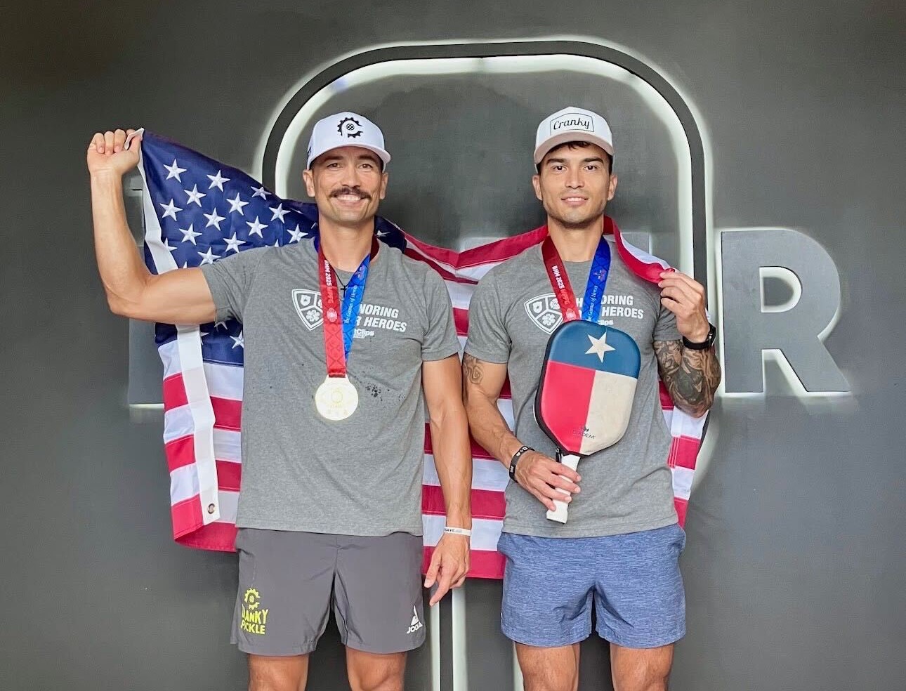 Martin and Chris Robertson celebrate their men's doubles gold medal in Birmingham, AL.