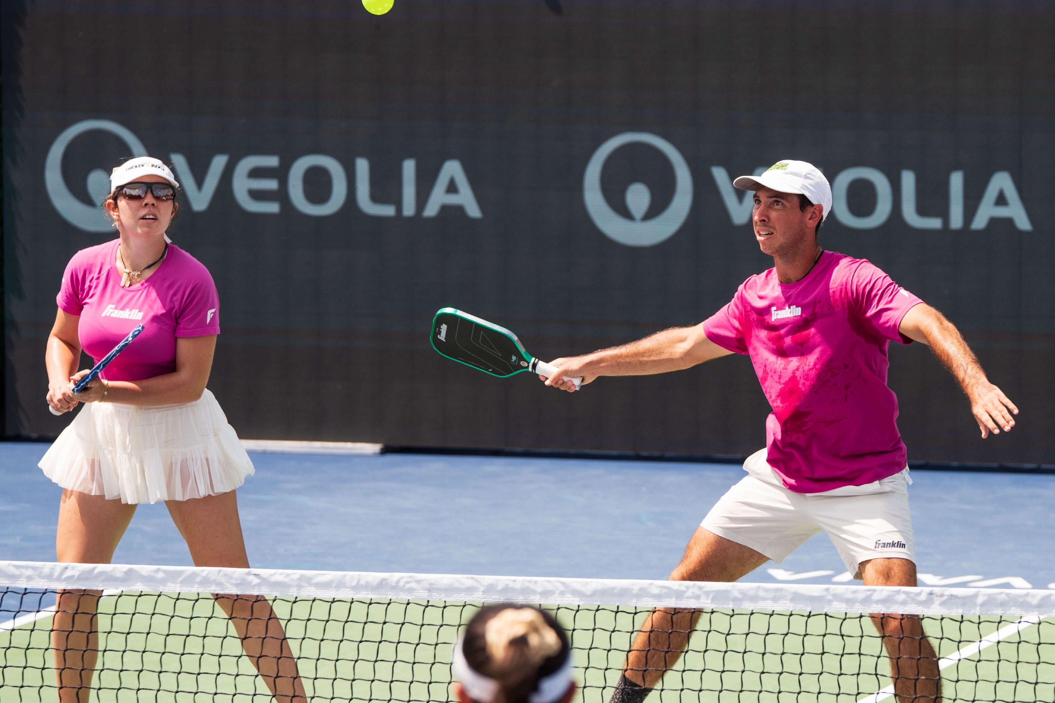 Johnson siblings in hot pink shirts and white bottoms