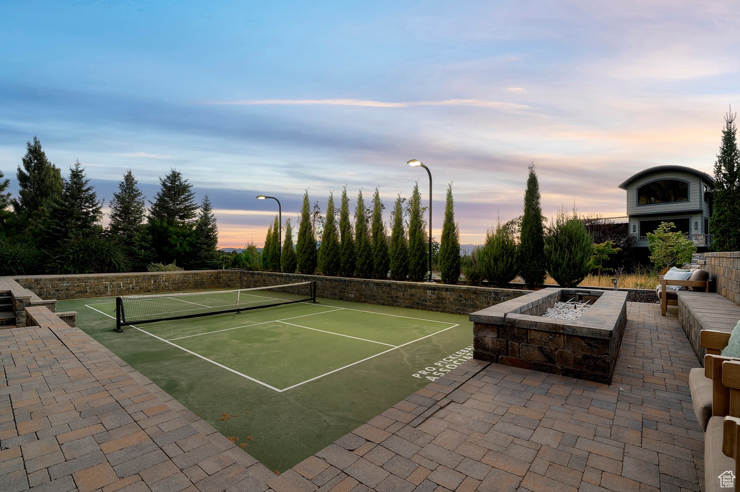 A view of the pickleball court in the backyard.