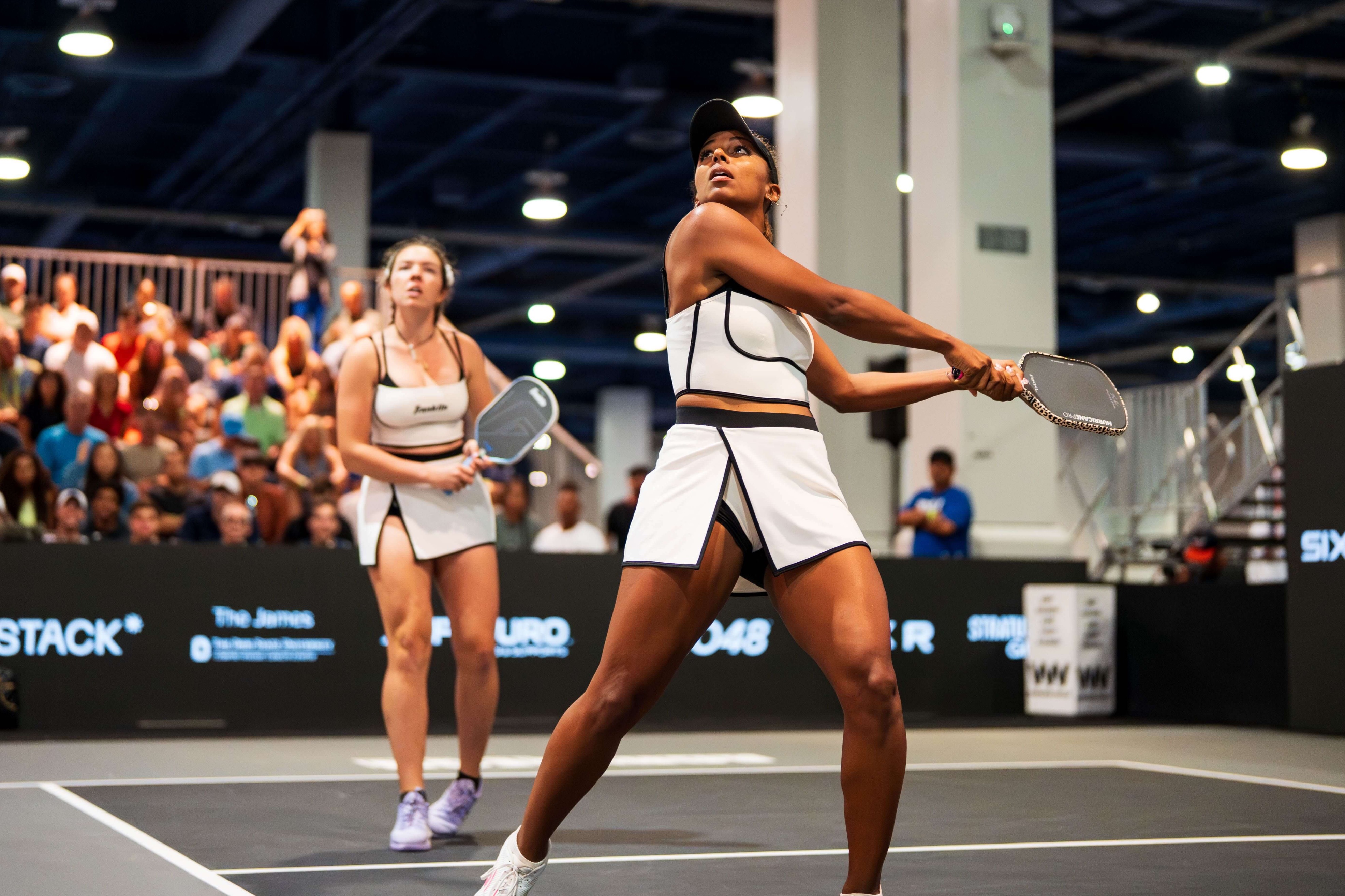 Johnson and Black in white tops and skirts