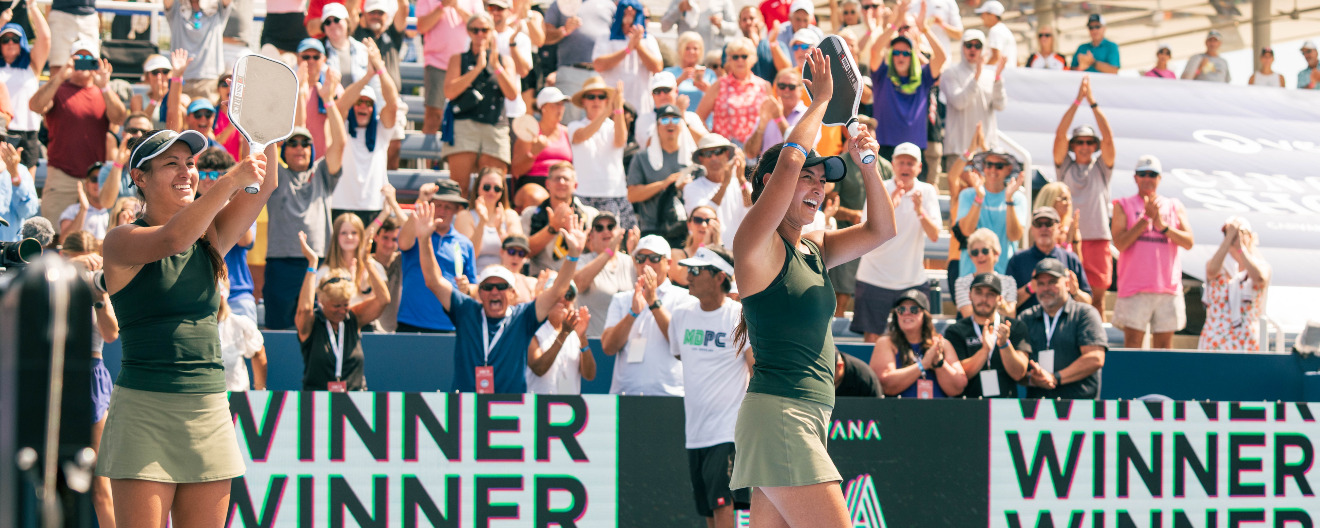 Jackie Kawamoto and Jade Kawamoto celebrating their title at the Veolia Cincinnati Showcase presented by Six Zero.