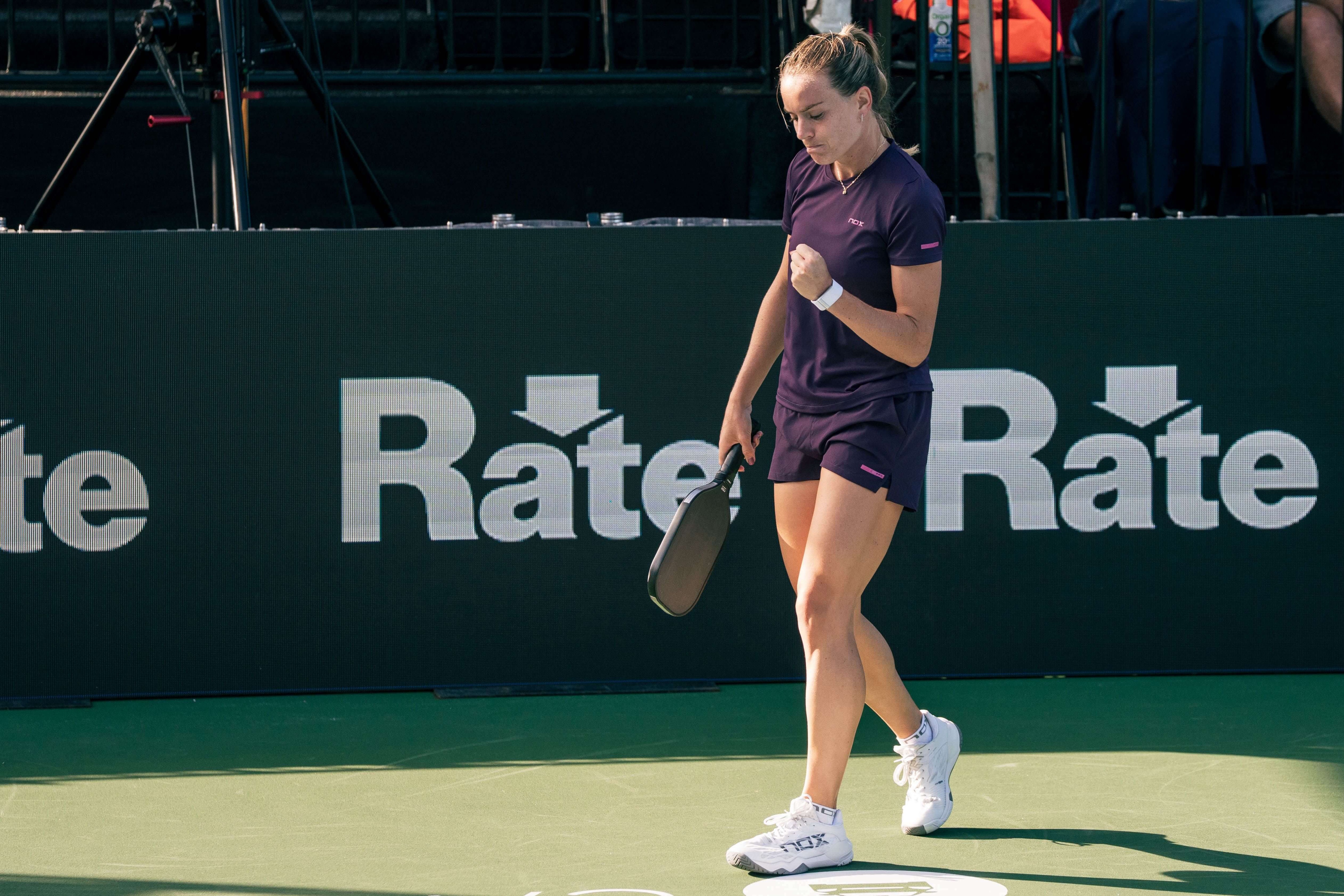 Castillo in dark purple t-shirt and shorts