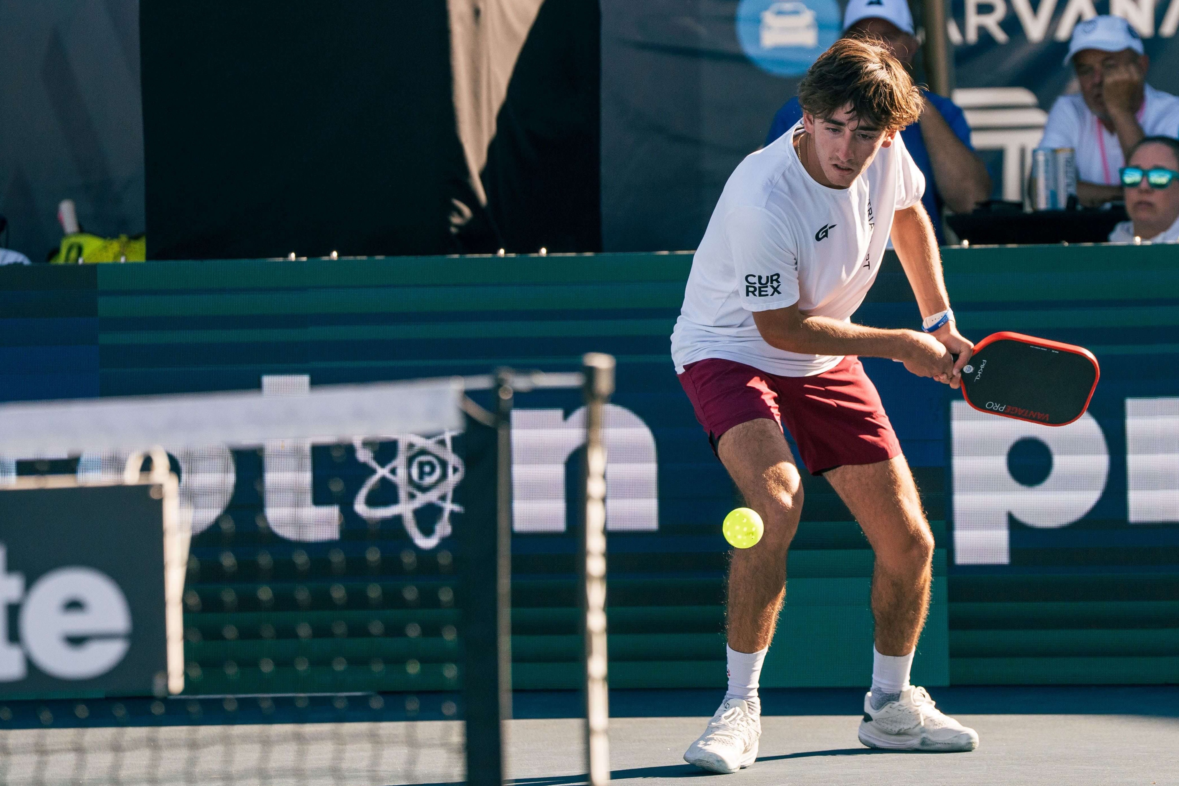 Tardio in a white t-shirt and red shorts