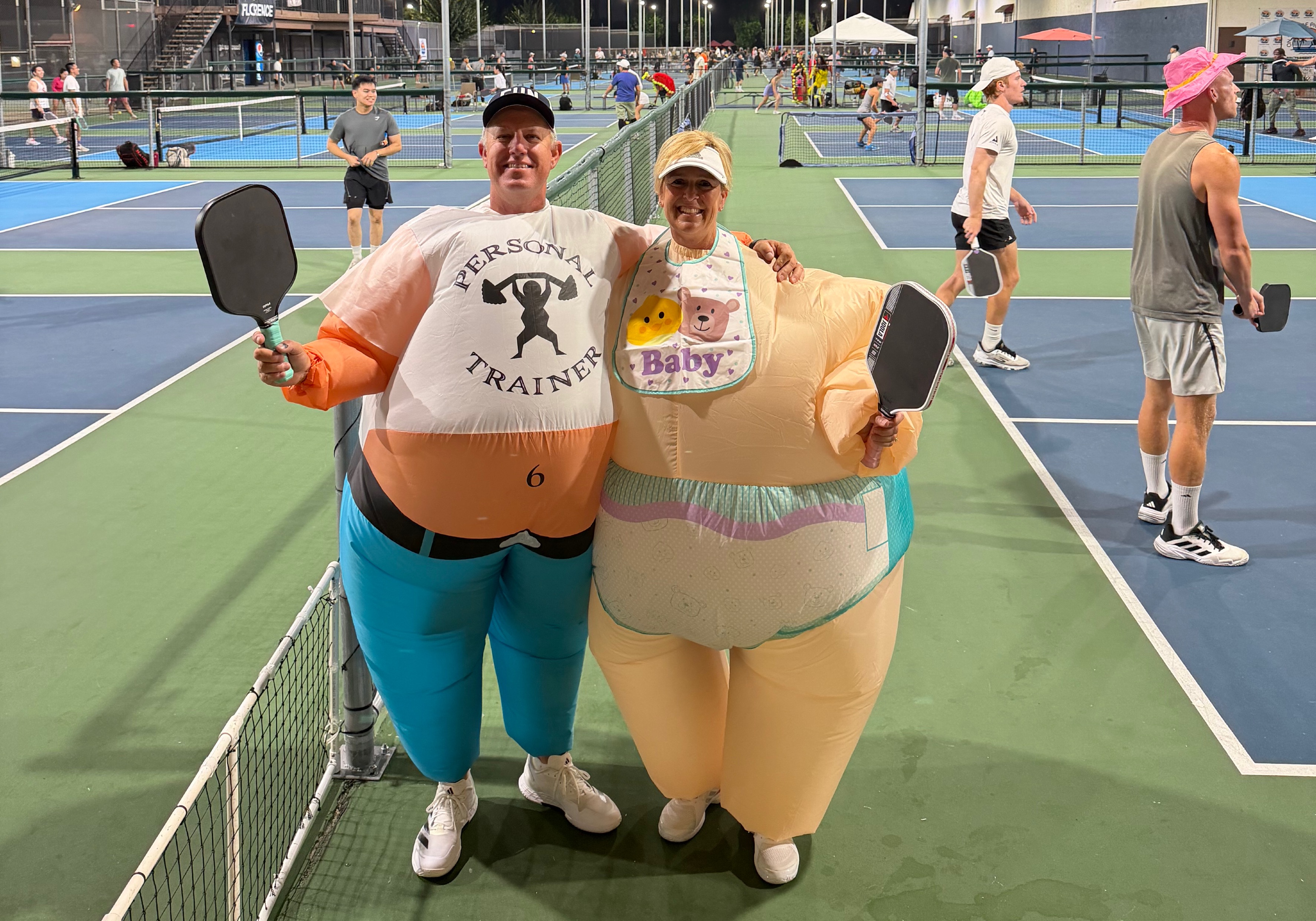 Vinnie dressed as an inflatable personal trainer, and Mrs. Brascia dressed as a big baby