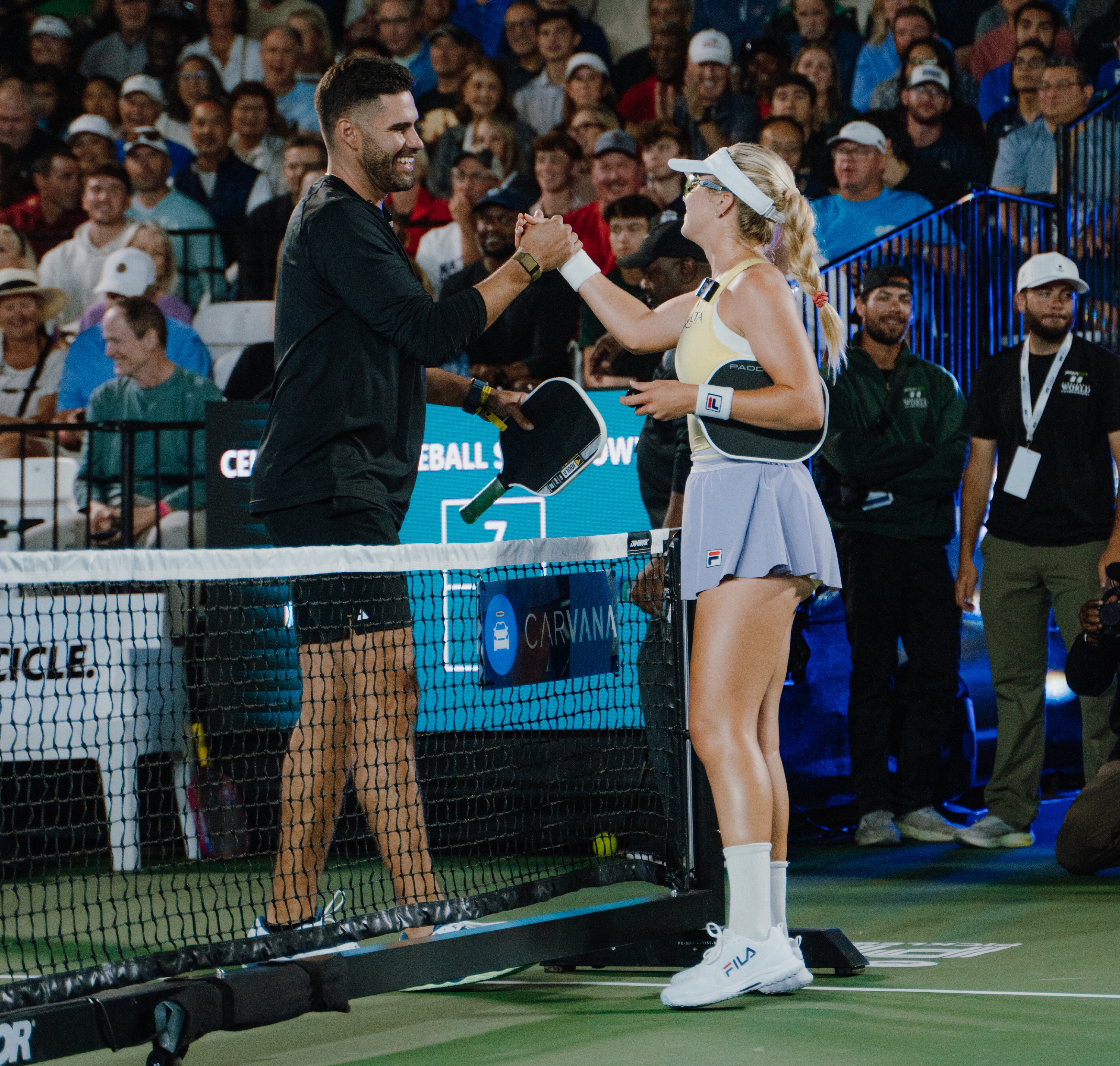 J.D. Martinez and Anna Leigh Waters shake hands after their match.