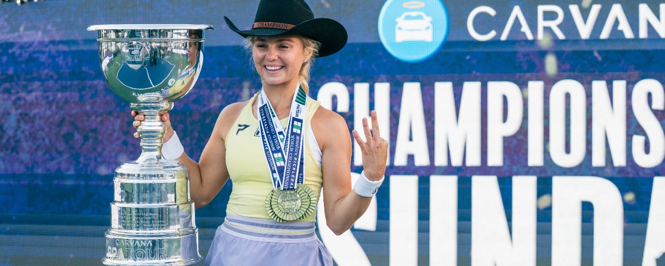 Anna Leigh Waters posing with her medals on Championship Court.