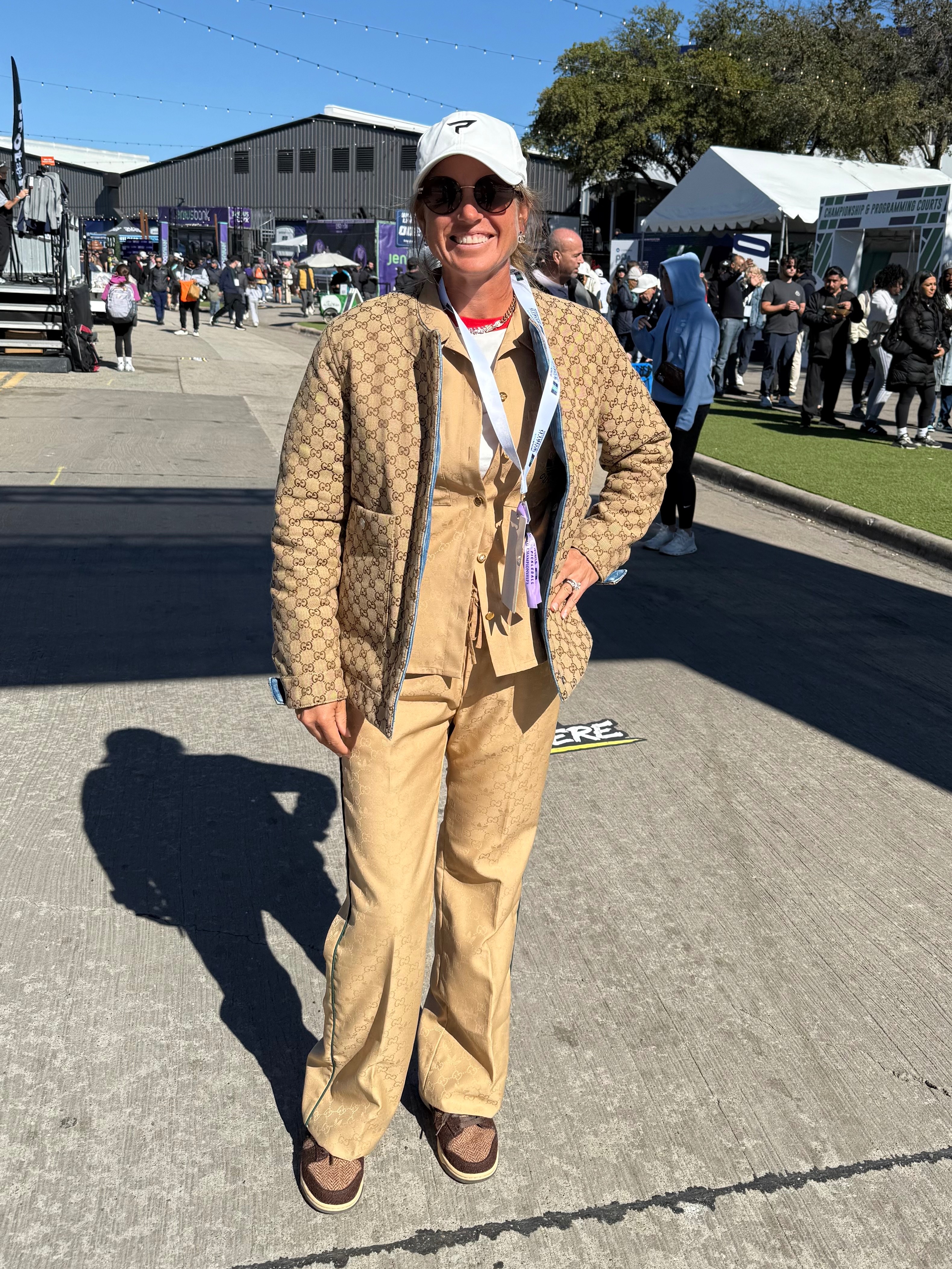 Waters in a Gucci puffer jacket and tan set