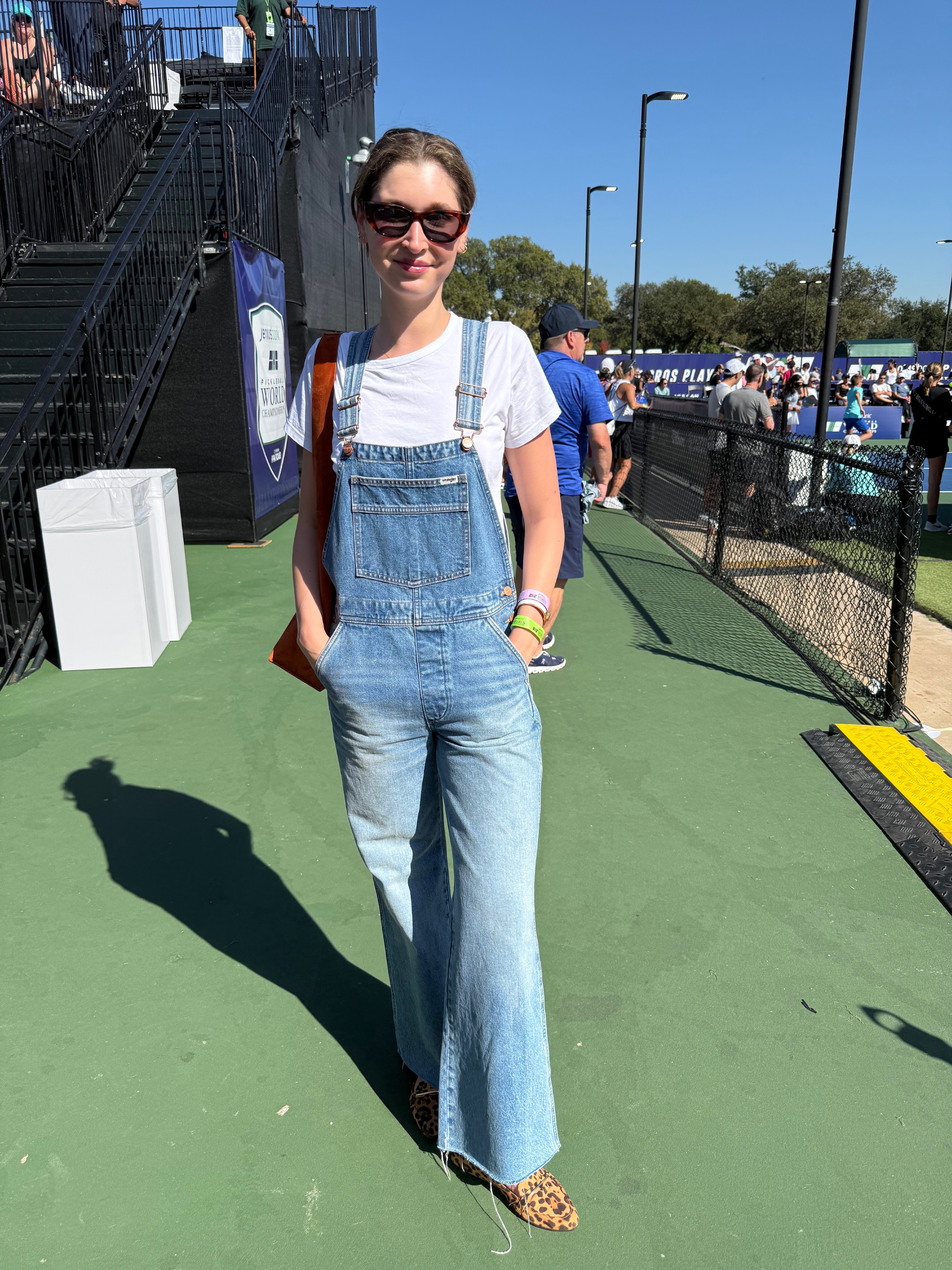 Kasper in denim overalls and cheetah print loafers