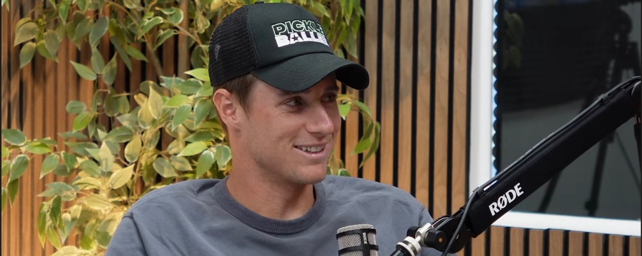 Roscoe Bellamy talking into a mic with a Pickleballers hat on.