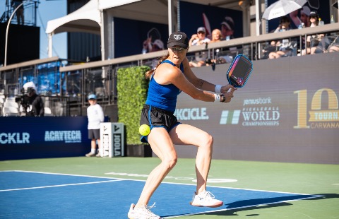 Kaitlyn Christian preparing to hit a return.