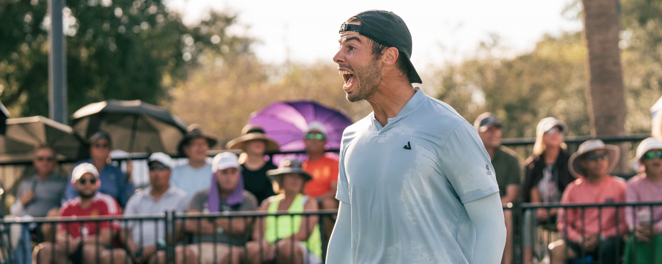Ben Johns yelling joyfully on the pickleball court.