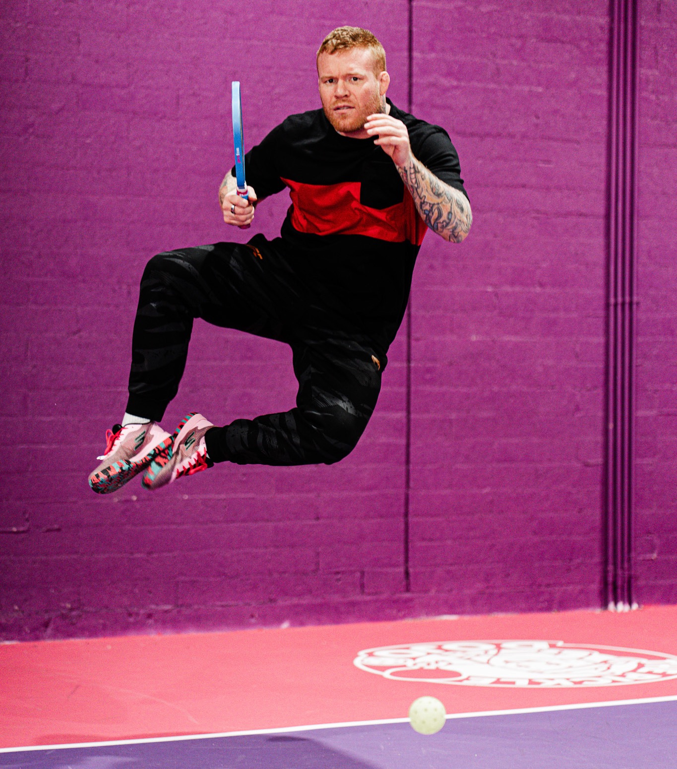 Coach Tim Welch showcasing his athleticism with a paddle in hand.