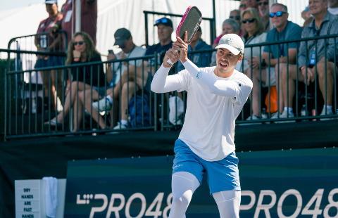 Ben Johns hitting a pickleball backhand.