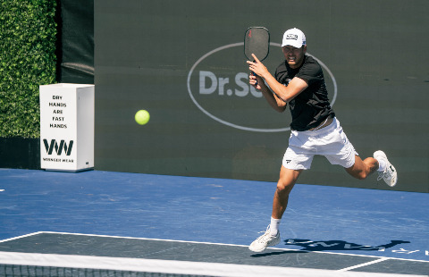 Connor Garnett hitting a pickleball backhand.
