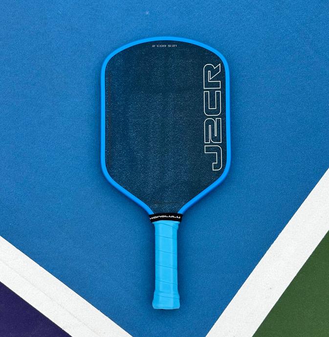 Honolulu J2CR Crystal Blue Endurance Grit Pickleball Paddle on court